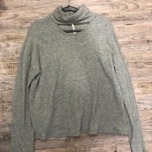 Turtleneck with chest cutout.